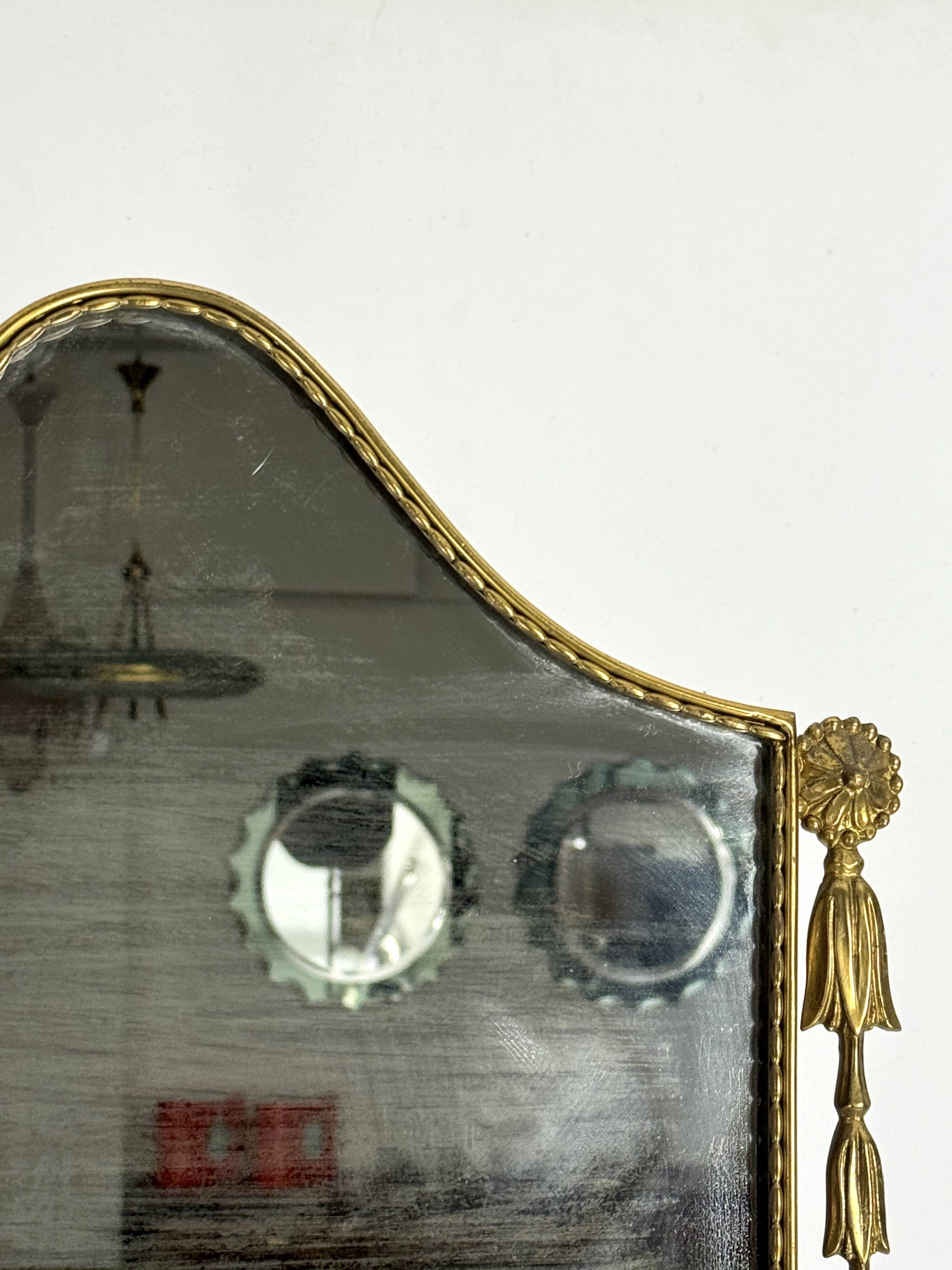 Mid-century Italian mirror in brass. Italy 1950s