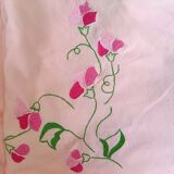 Nappe rose avec couronne de fleurs + 10 serviettes