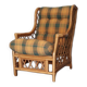 Vintage armchair in bamboo and rattan with a tartan pattern.