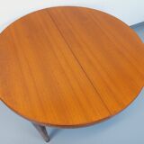 Large vintage Scandinavian round table from the 50s 60s in teak with extensions