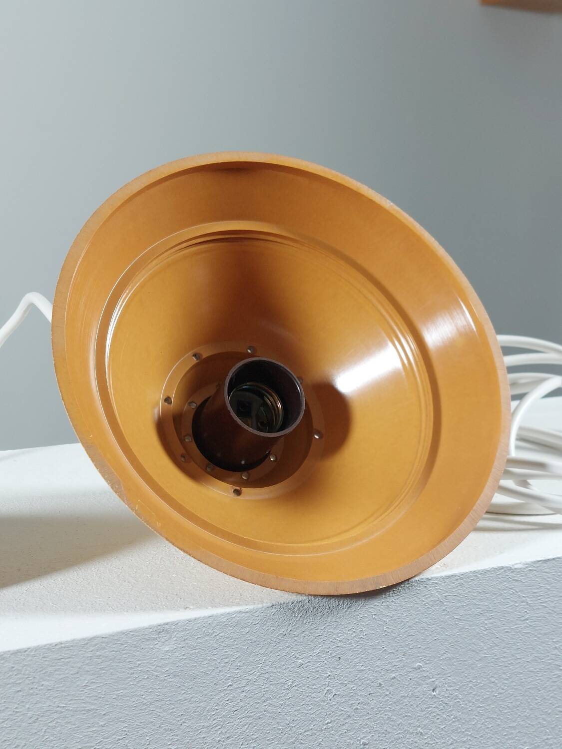 Vintage suspension in yellow lacquered Bakelite from the 1950s.