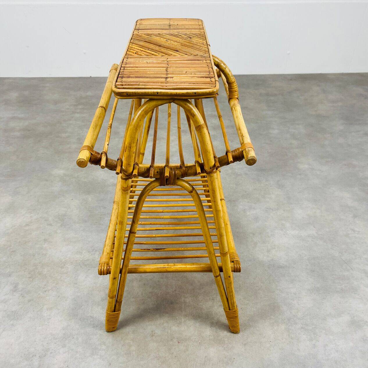 1960s rattan and bamboo coffee table, with its magazine rack.