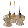 Trio of amber glass pendant lights
