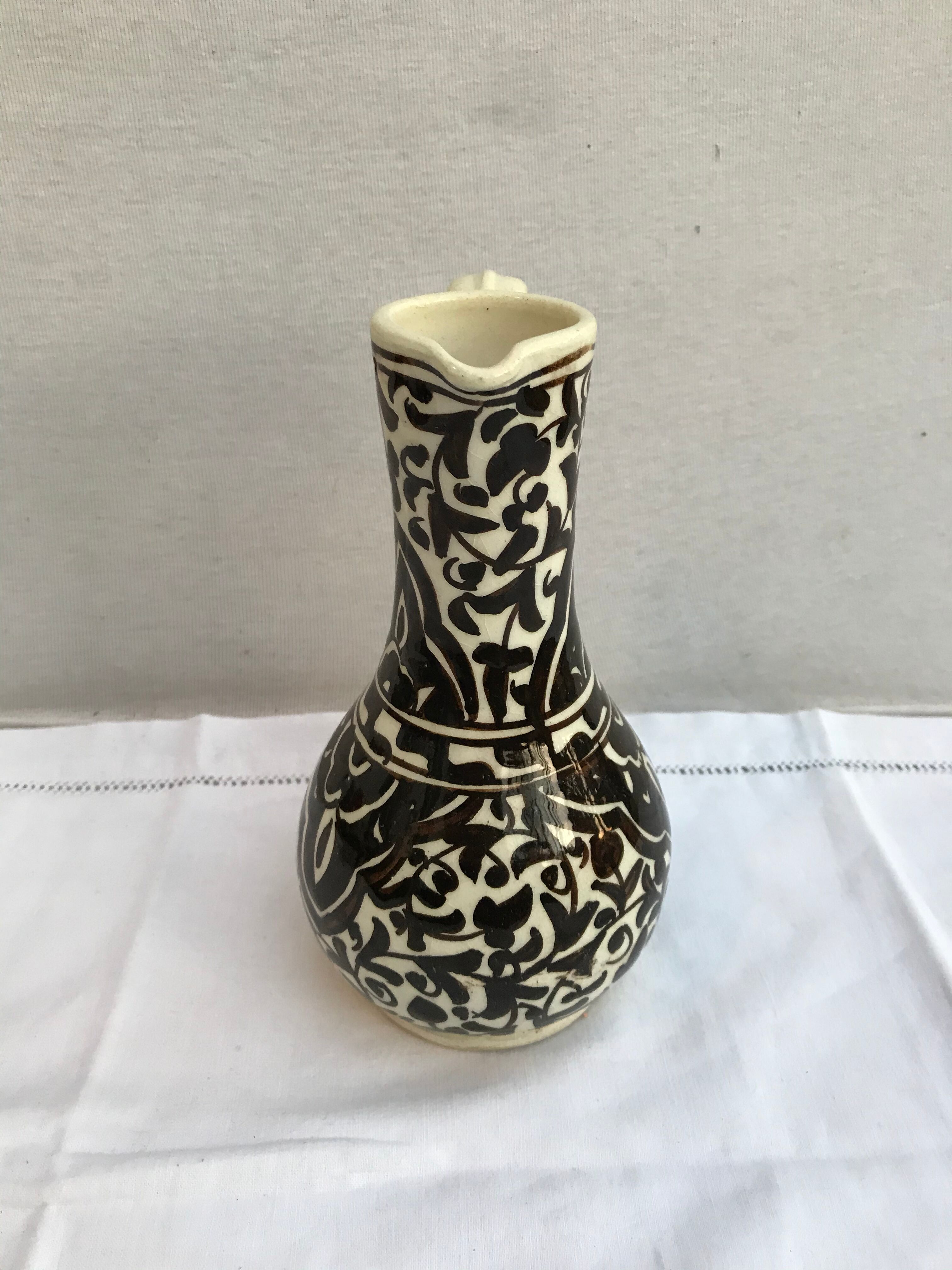 Former beige cracked ceramic pitcher