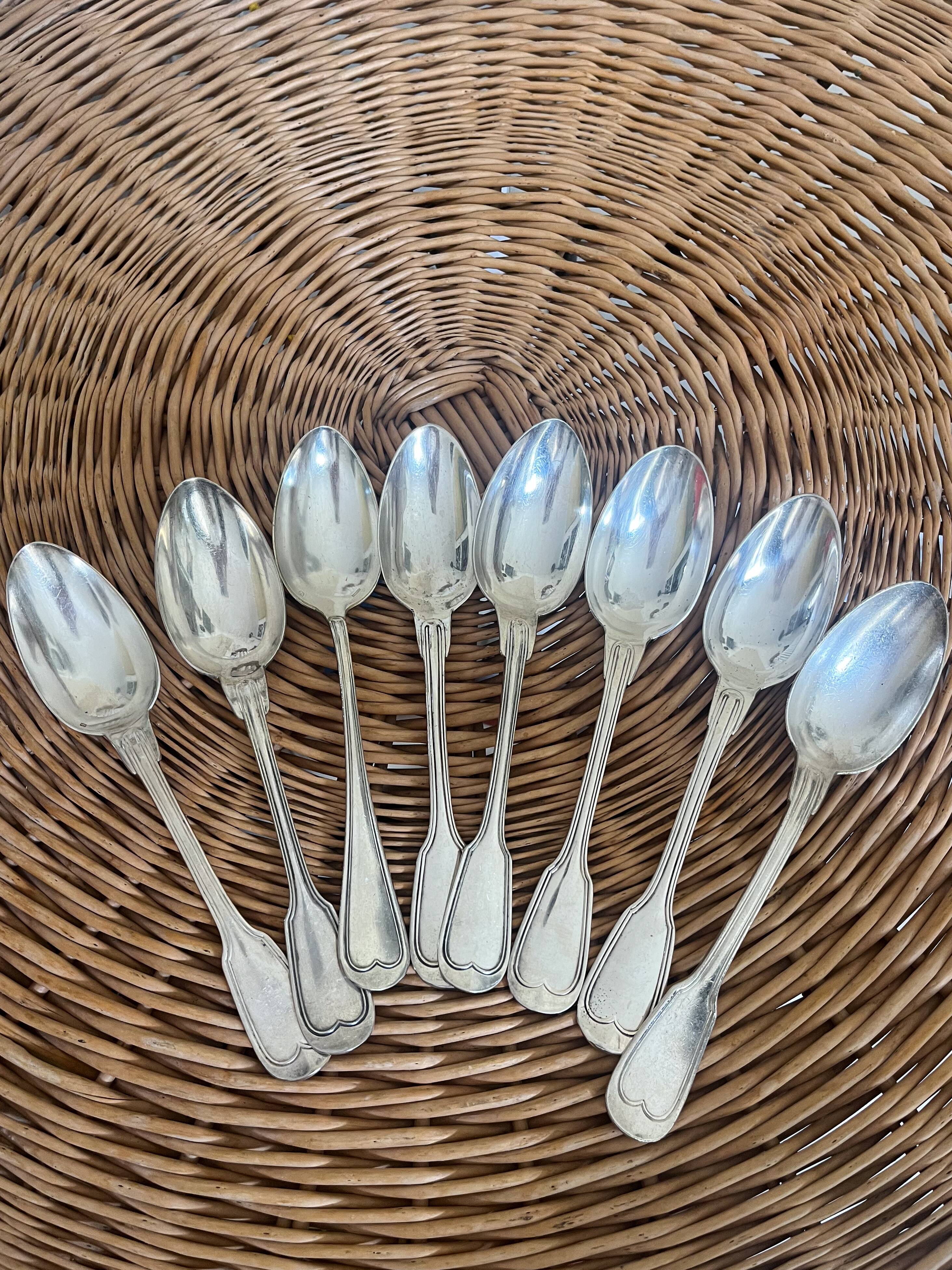 Set of 8 silver metal spoons