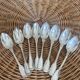 Set of 8 silver metal spoons