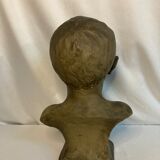 Bust of a young boy, plaster, monogrammed, circa 1900