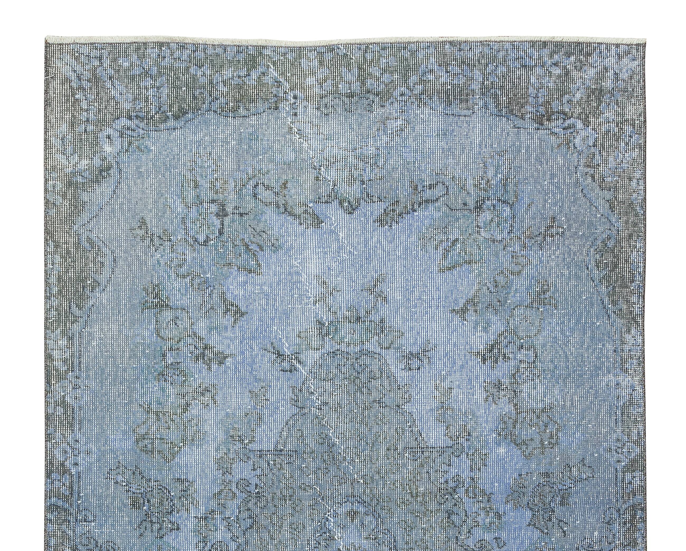Hand-knotted turkish rug over-dyed in light blue