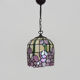 Tiffany pendant lamp in glass paste with floral decoration.