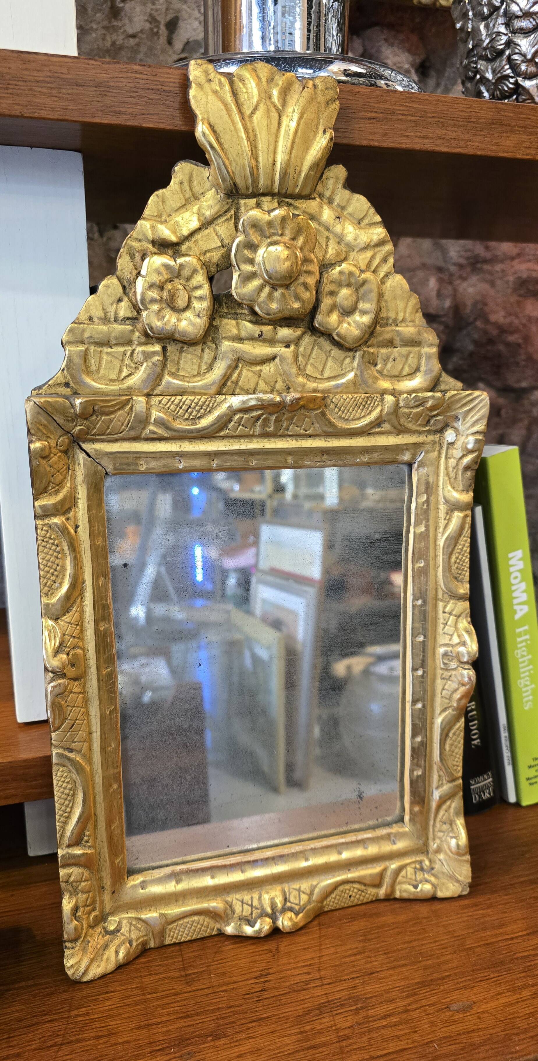 Small Louis XIV mirror in gilded carved wood from the early 18th century.