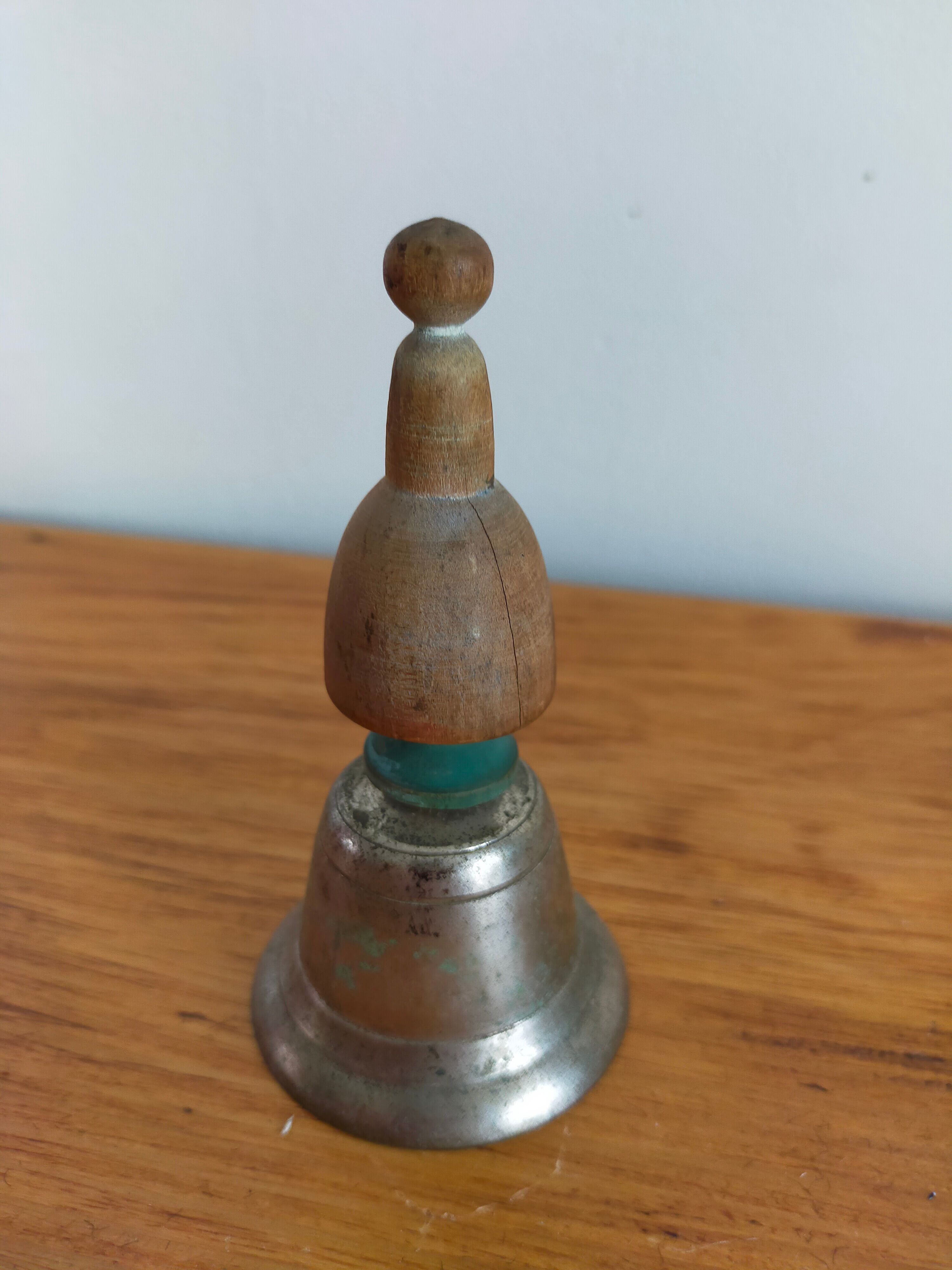 Vintage metal bell and wooden handle