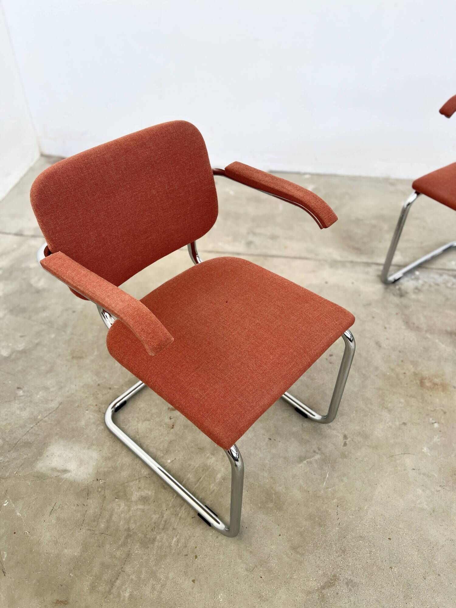 Pair of Marcel Breuer B64 Knoll armchairs in coral fabric