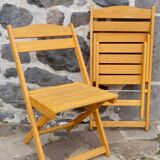 Pair of folding chairs in blond wood