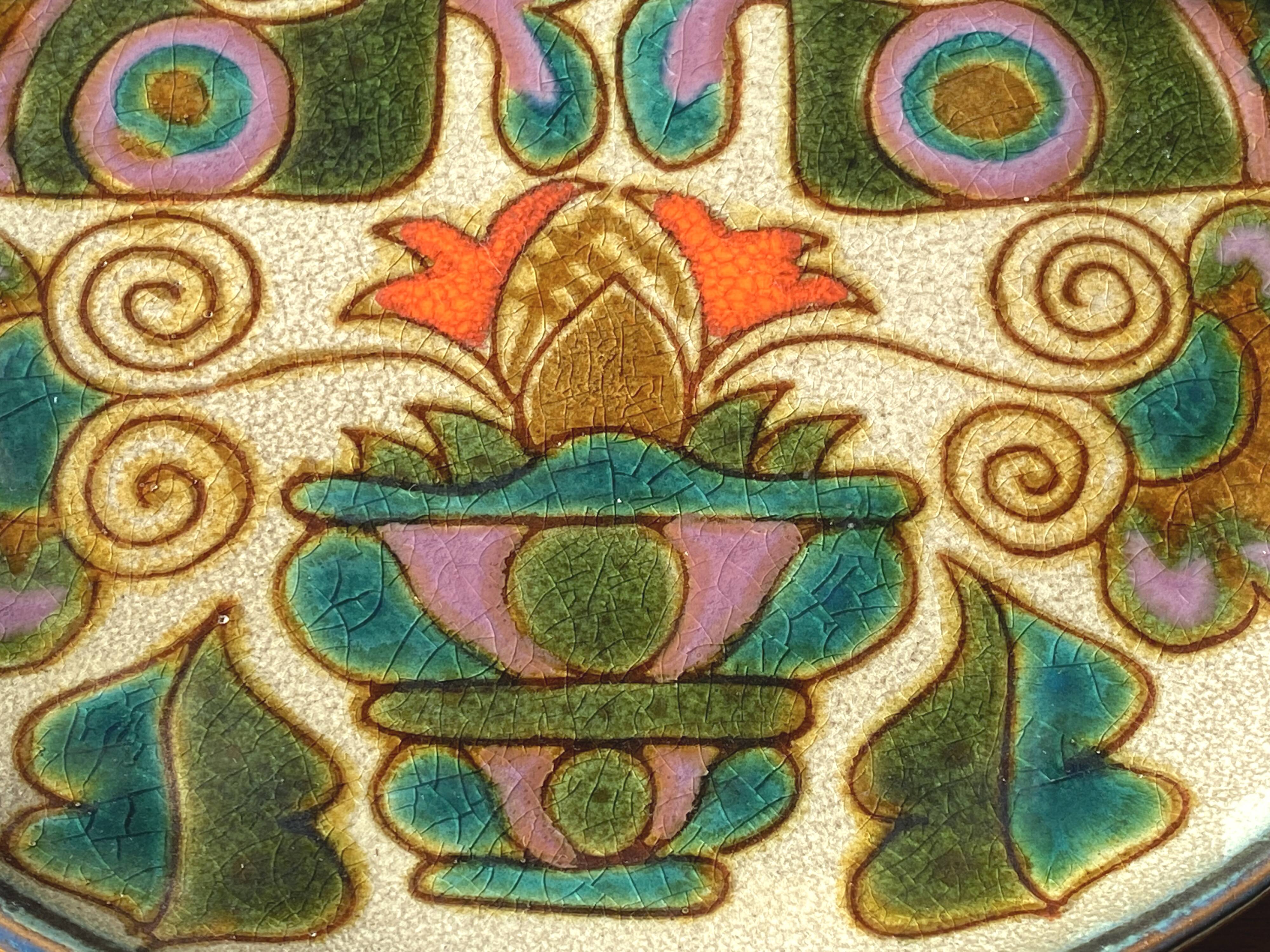 Vintage ceramic plate with peacock bird decoration.