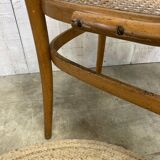 Curved wood and cane armchair