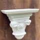 Carved wooden wall bracket