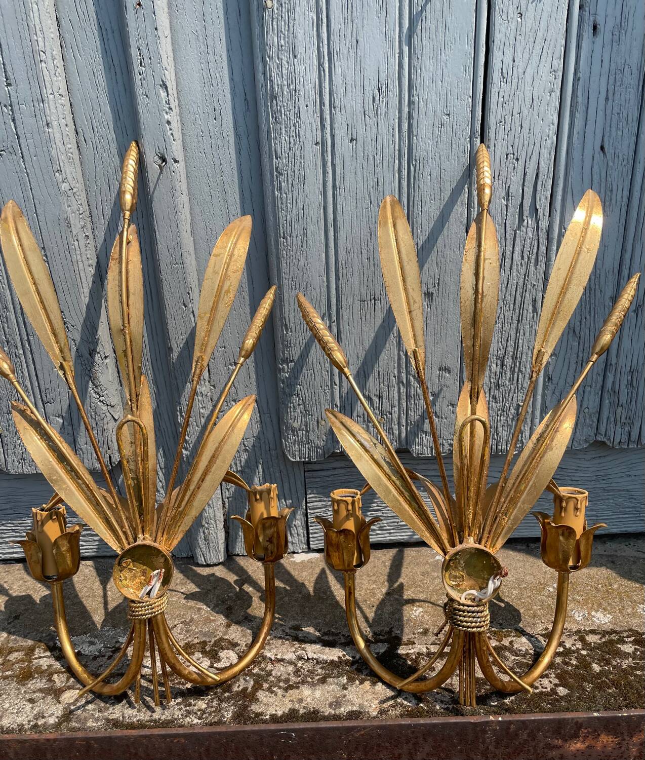 Pair of wall sconces in the shape of a wheat sheaf with two lights.