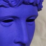 Large bust of a Greek Roman Apollo on a pedestal