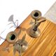 Pair of brass candlesticks with plant decoration