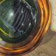 Large vintage Murano glass ashtray in olive green and amber.