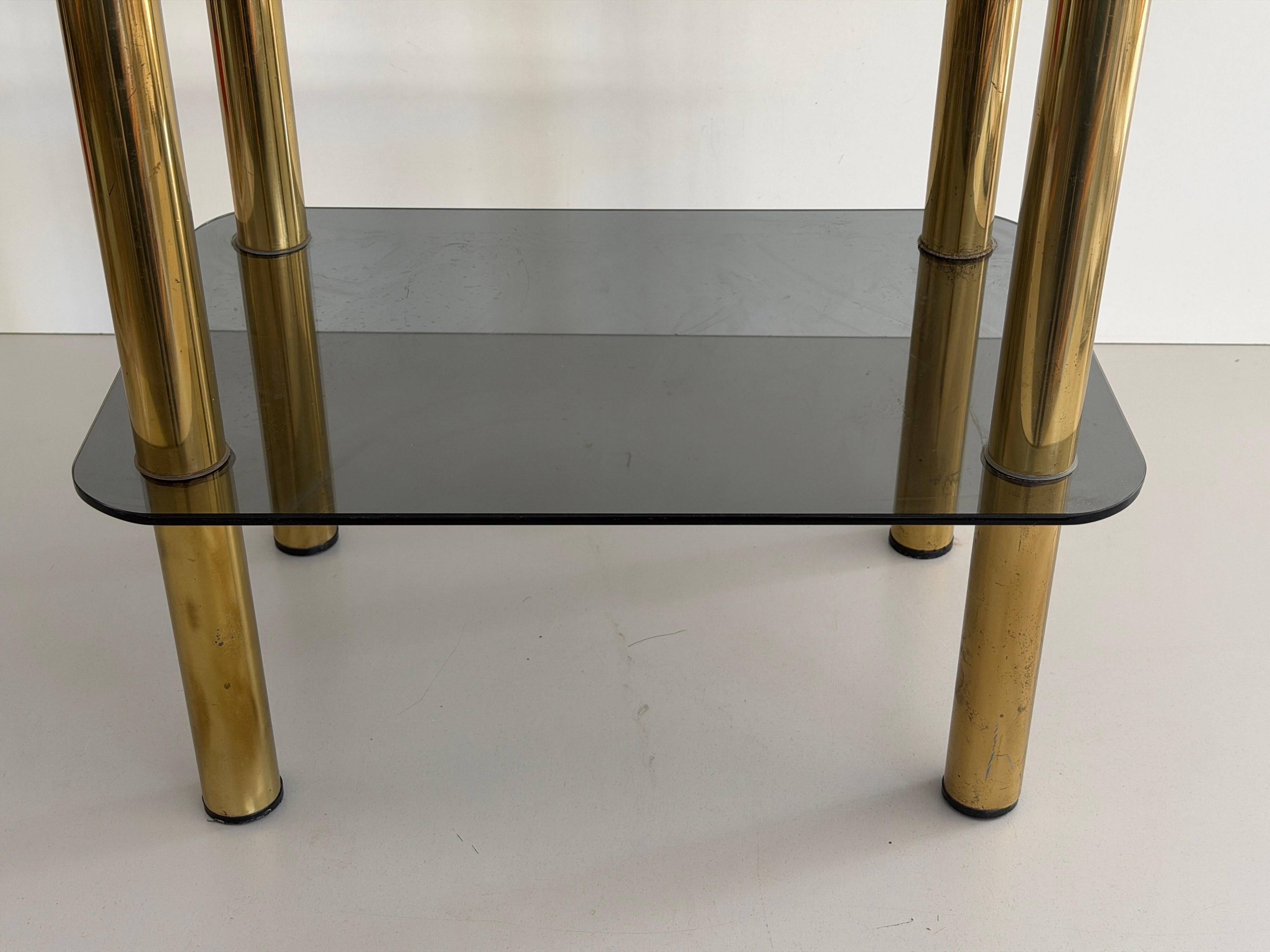 Side table in thick greenish glass with brass legs, Italy, 1960s.