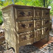 Curved antique commode in pistachio green patina.