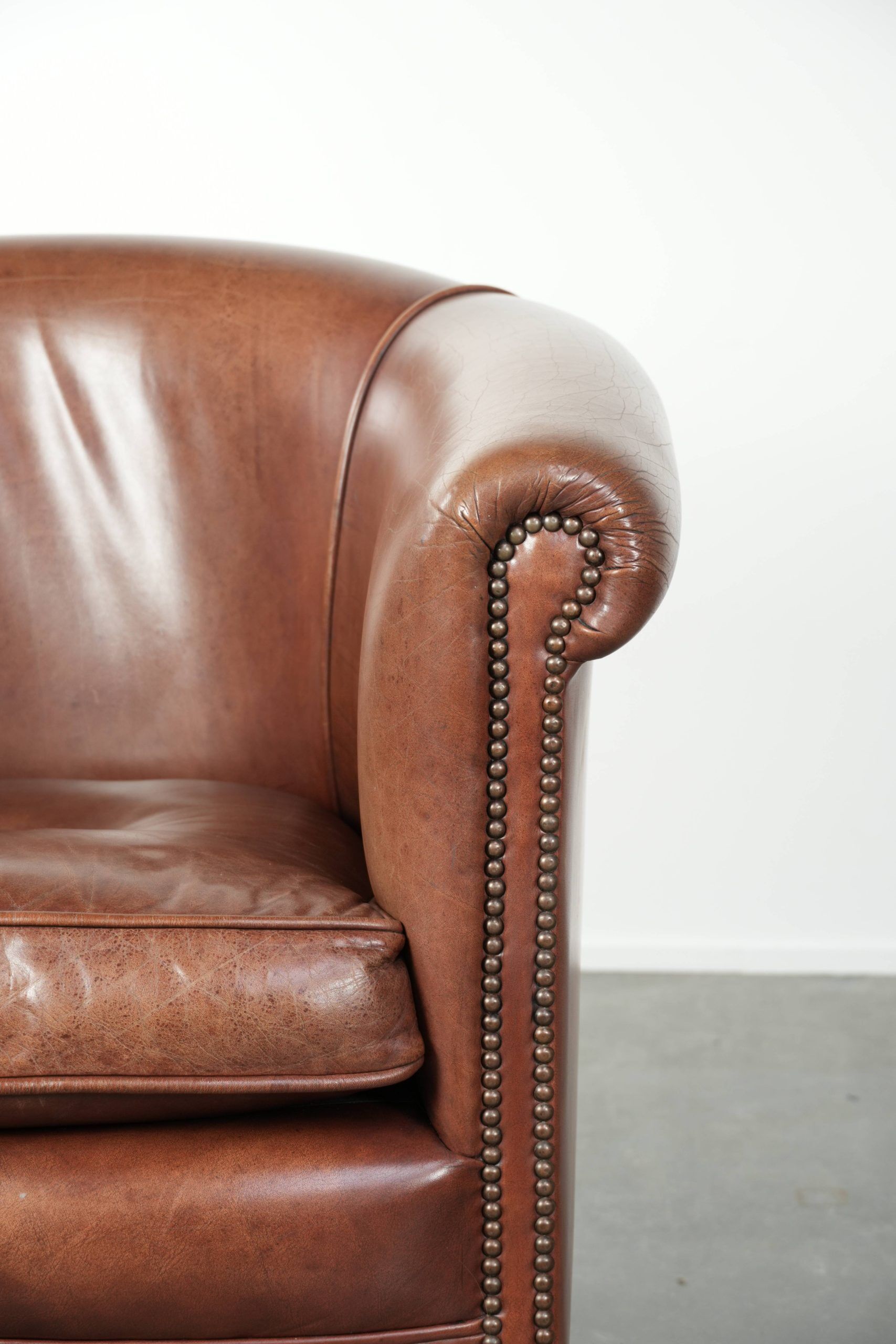 Cow leather club armchair in beautiful dark cognac colour in English style
