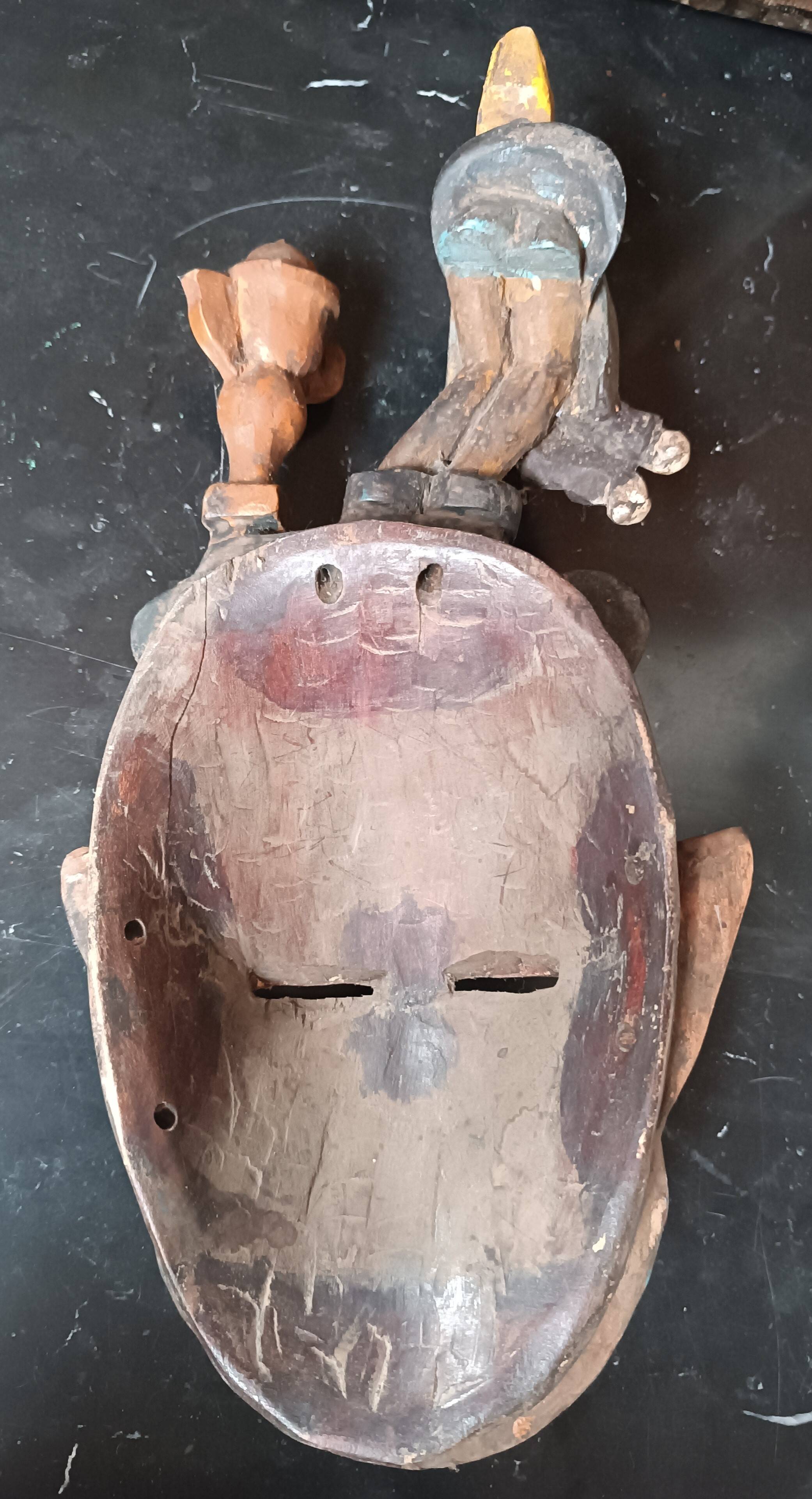 Old tribal ethnic mask in carved wood