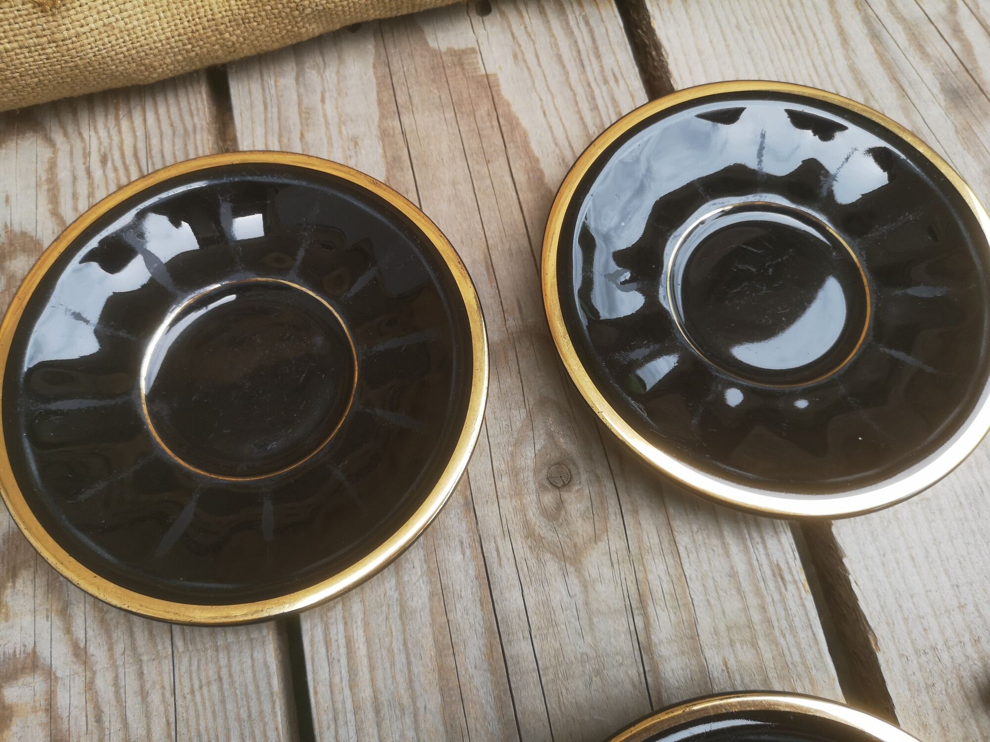 Set of 9 cups and sub-cups in black ceramic and colored gold border