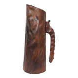 carved wooden pitcher