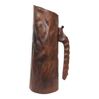 carved wooden pitcher