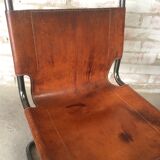 pair of tubular chairs in tawny leather