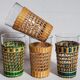 Four long drink glasses in vintage woven rattan cases