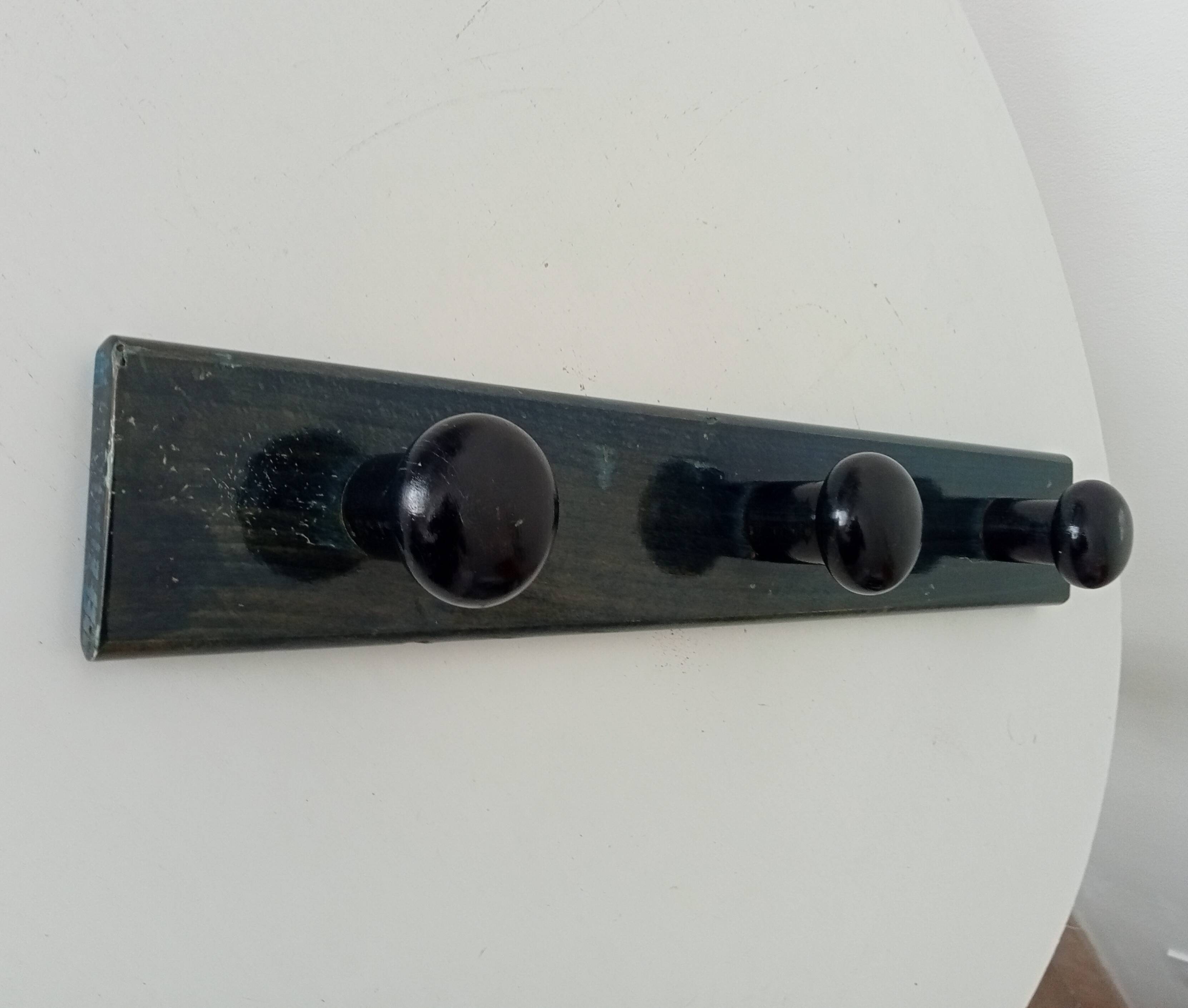 Vintage wall-mounted coat rack in lacquered wood from the 60s