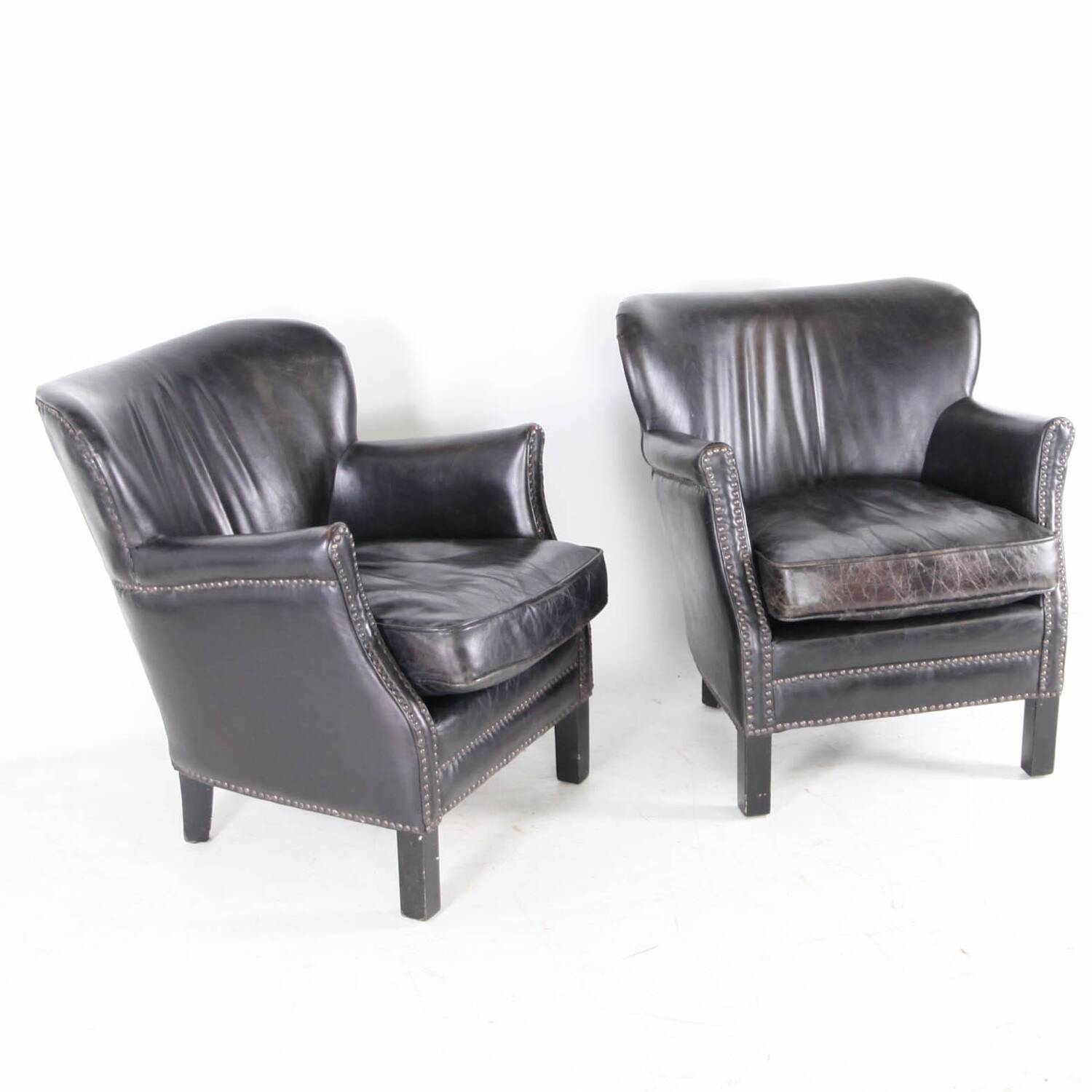 Pair of small leather club armchairs