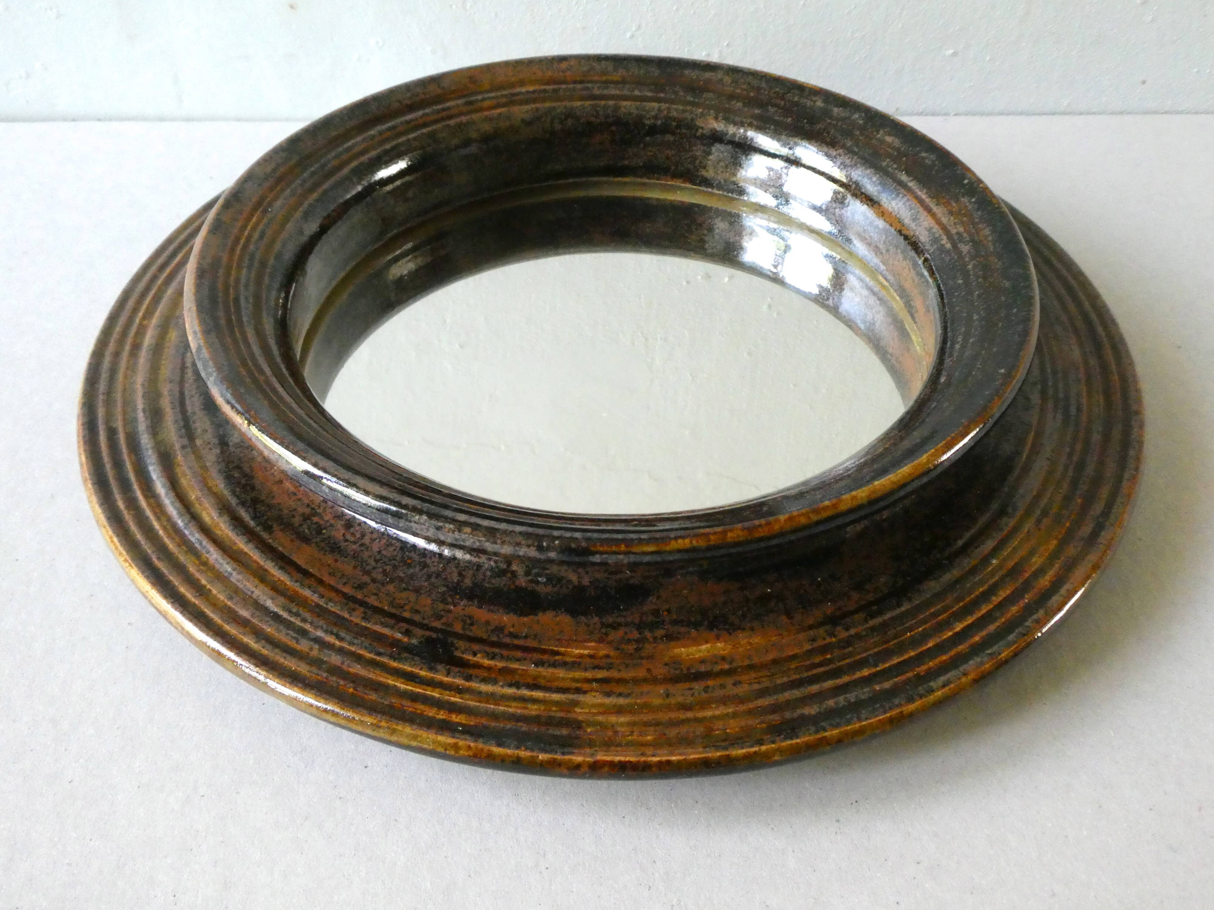 Sandstone mroir signed Robert Heraud, years 70, 27 cm