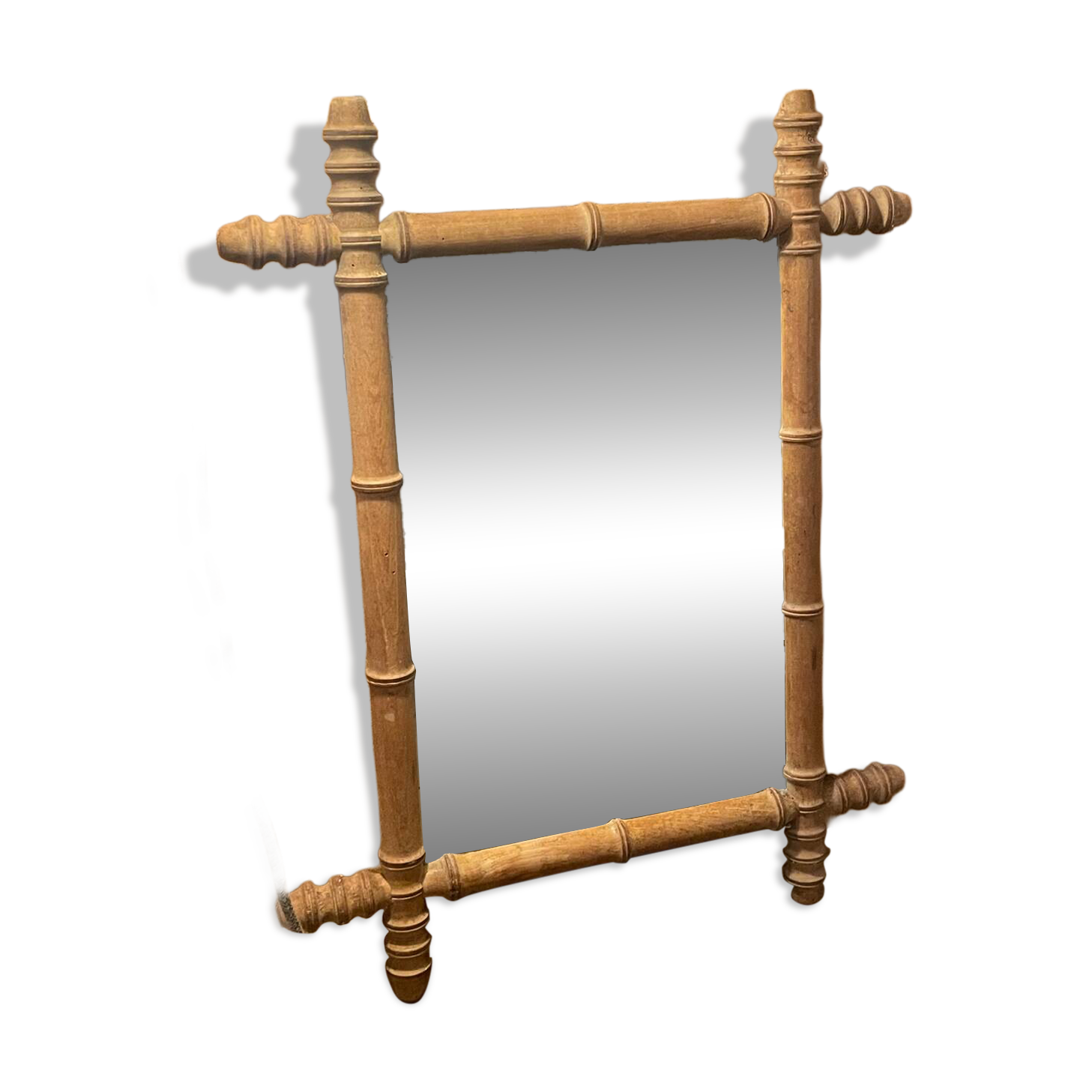 Carved wooden mirror in a bamboo style
