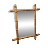 Carved wooden mirror in a bamboo style
