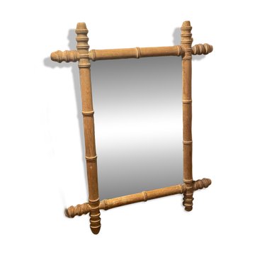 Carved wooden mirror in a bamboo style