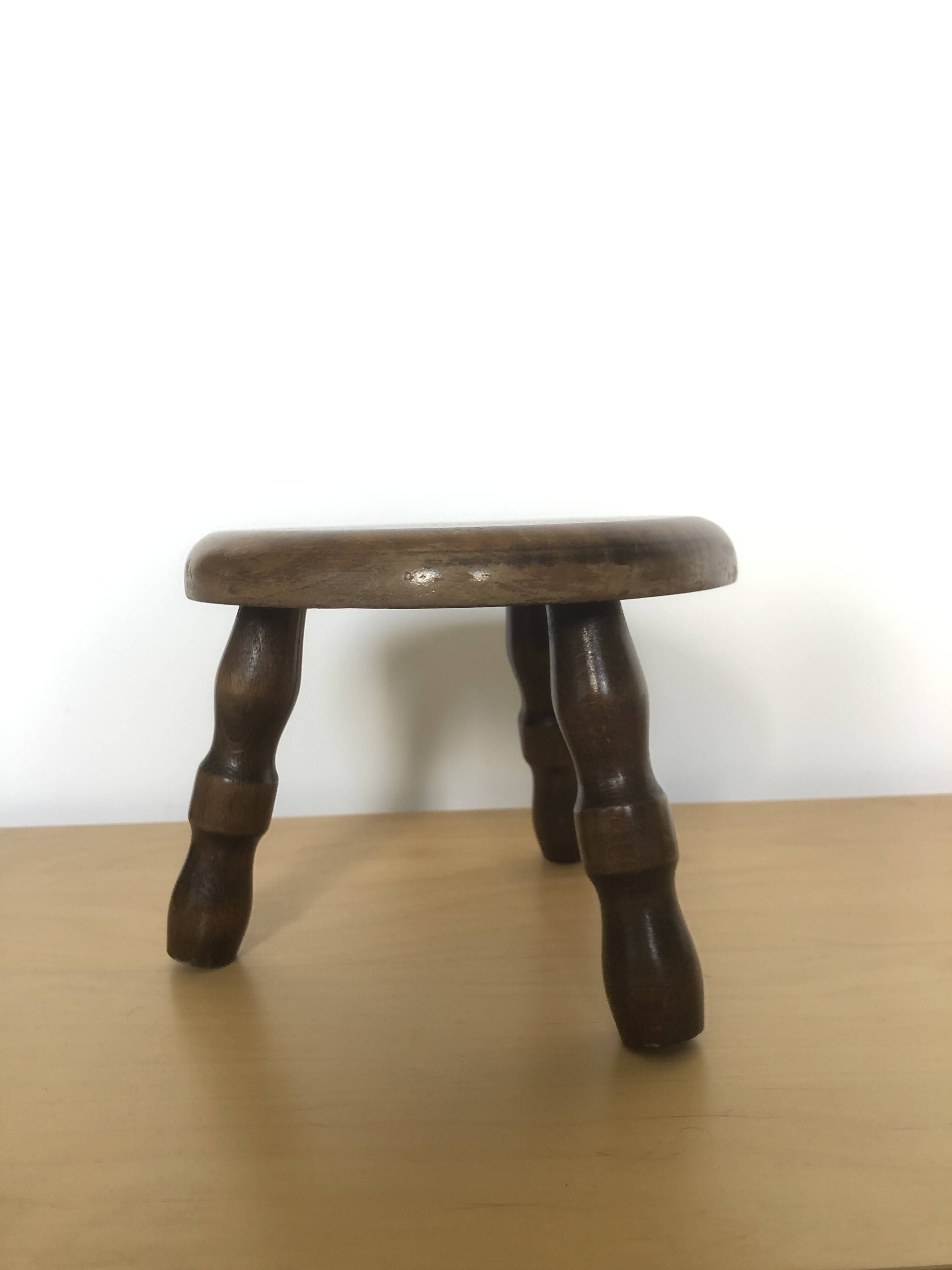 Low tripod stool in solid wood