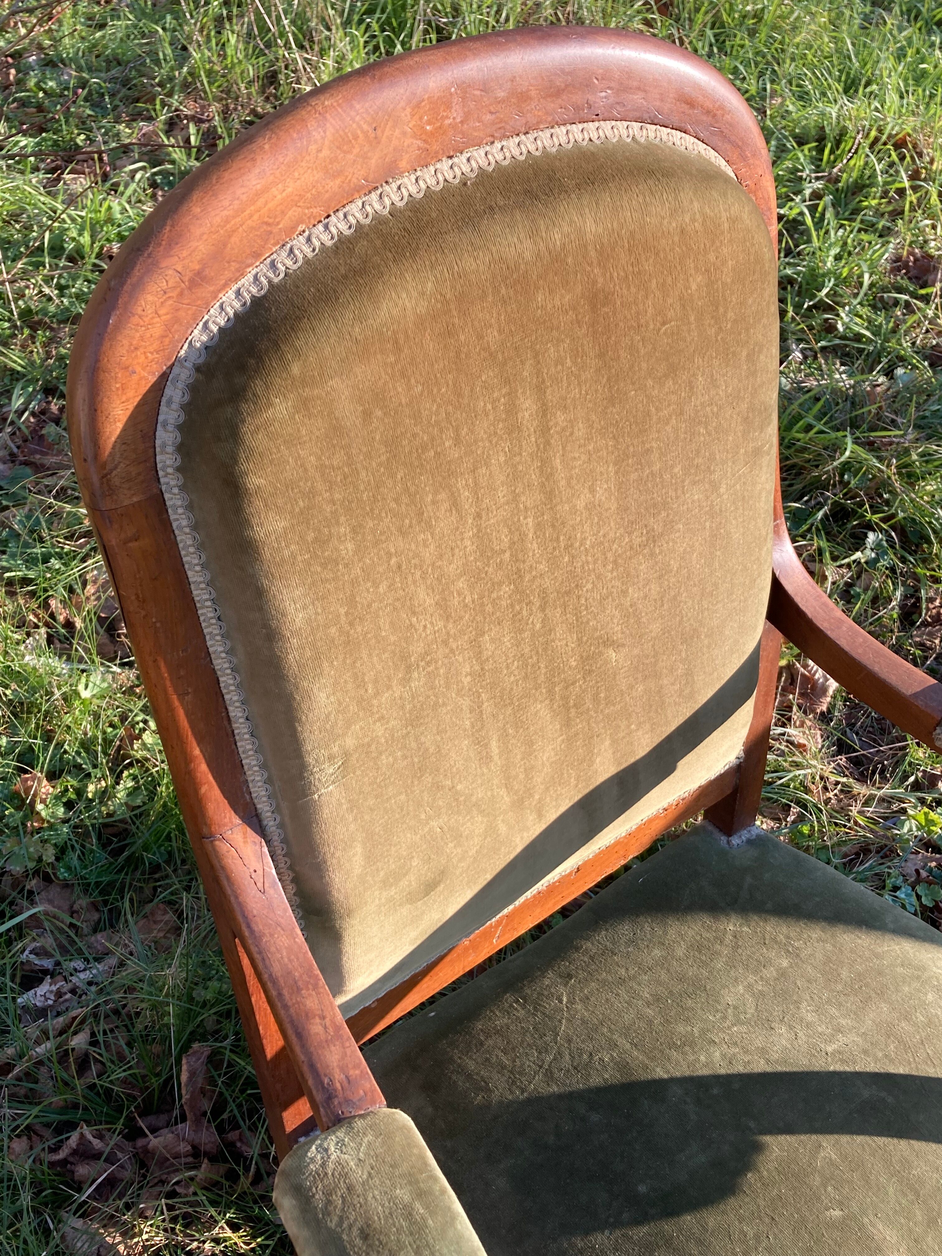 Antique Voltaire armchair in wood and green velvet Louis Philippe