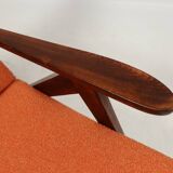 Vintage orange curly armchair Scandinavian design 1970