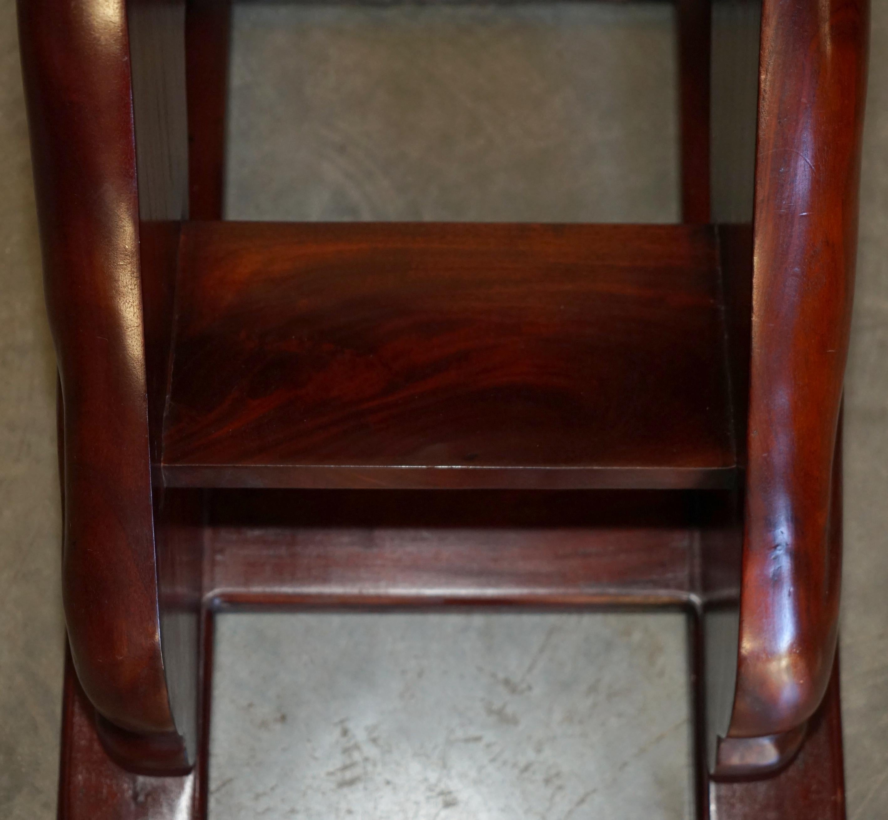 Pair of hardwood library steps with carved dogs, Regency style.