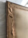 Old mirror with wooden frame and plaster moldings