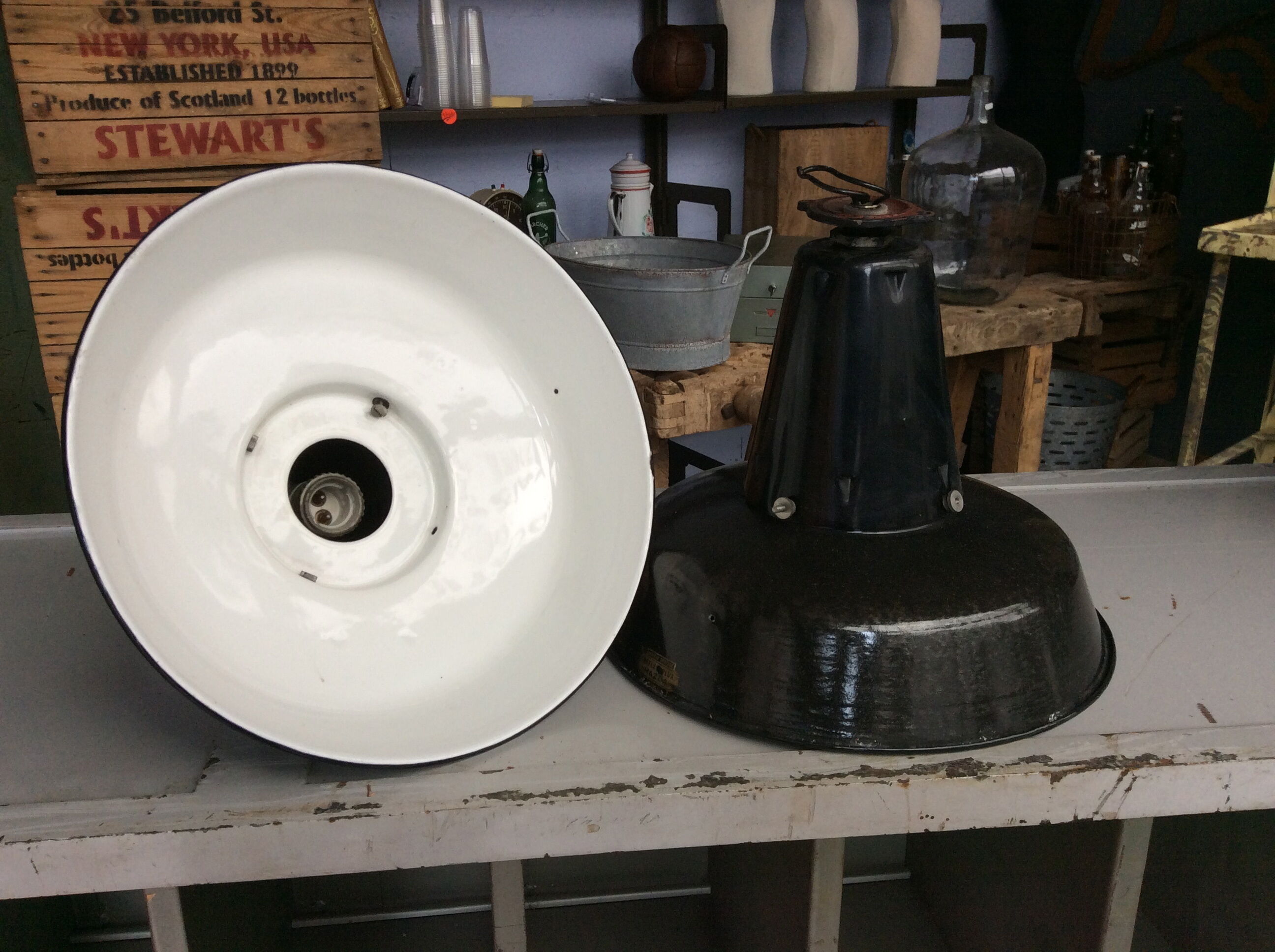 Hanging reflectolux mazda in black enamelled sheet metal.