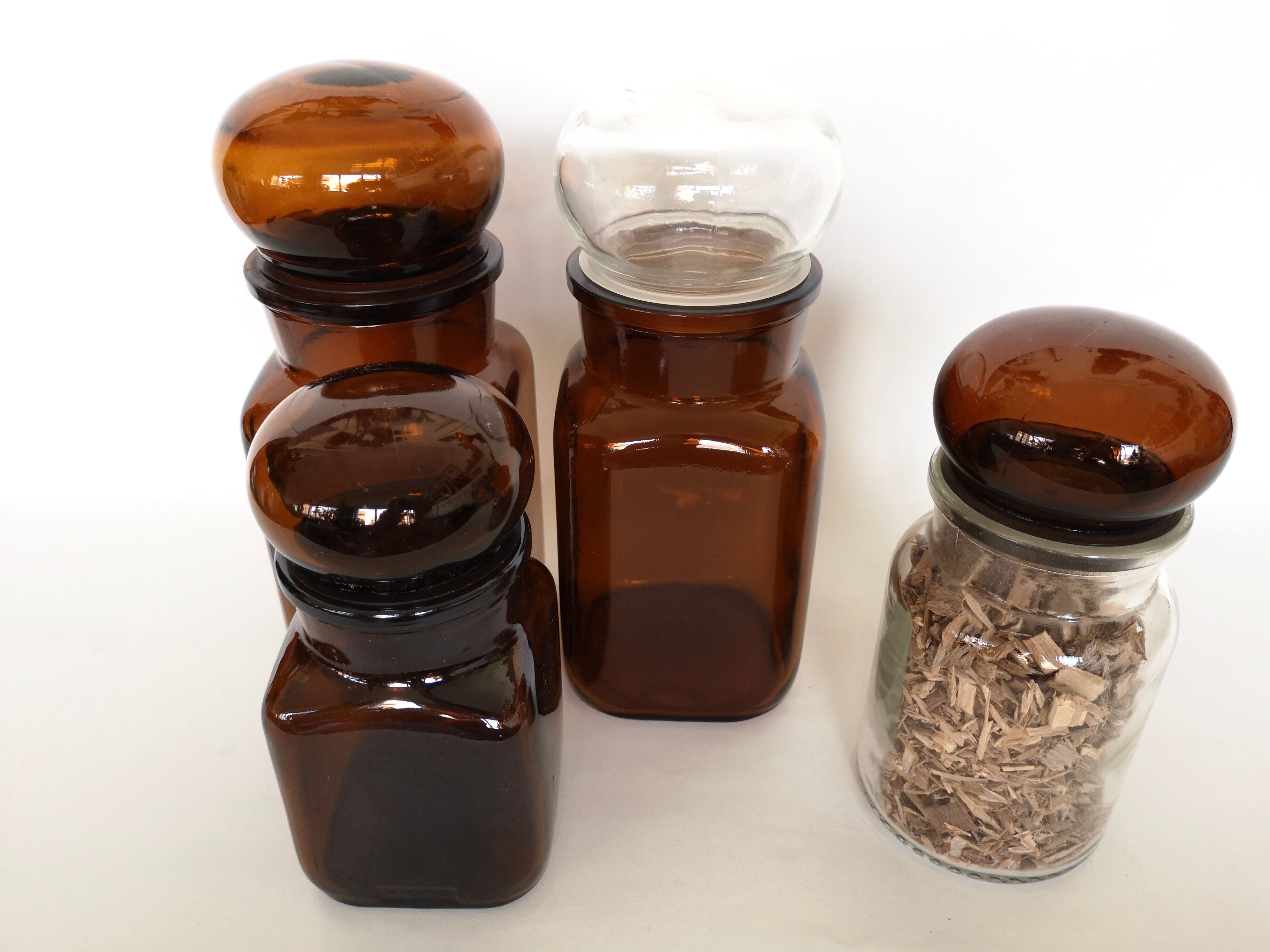 Set of 4 clear and brown glass jars