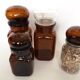 Set of 4 clear and brown glass jars
