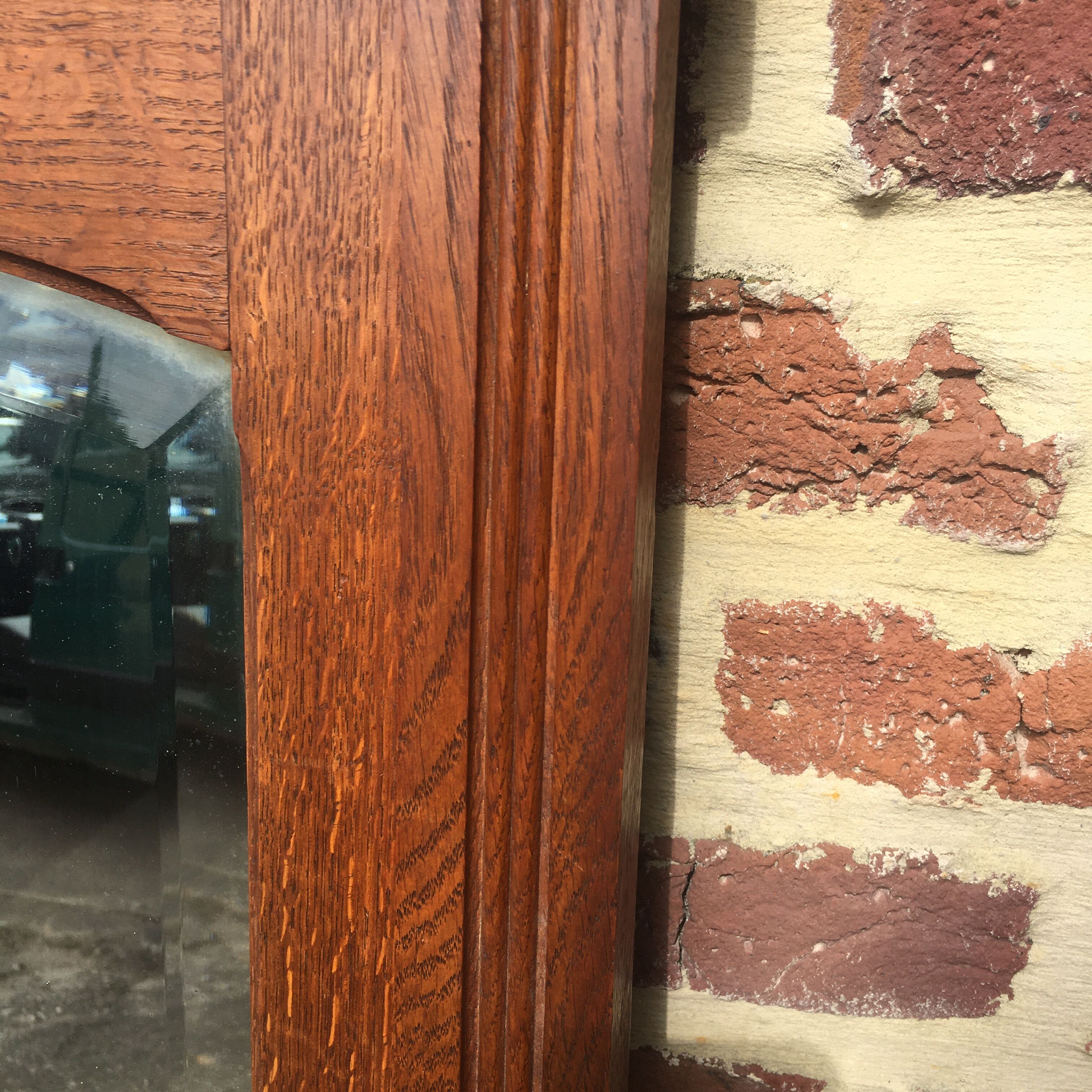 Beveled fireplace mirror