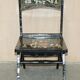 Pair of military folding chairs with Indian decoration.