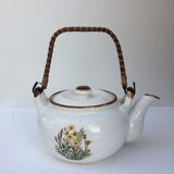 Vintage teapot with wicker handle